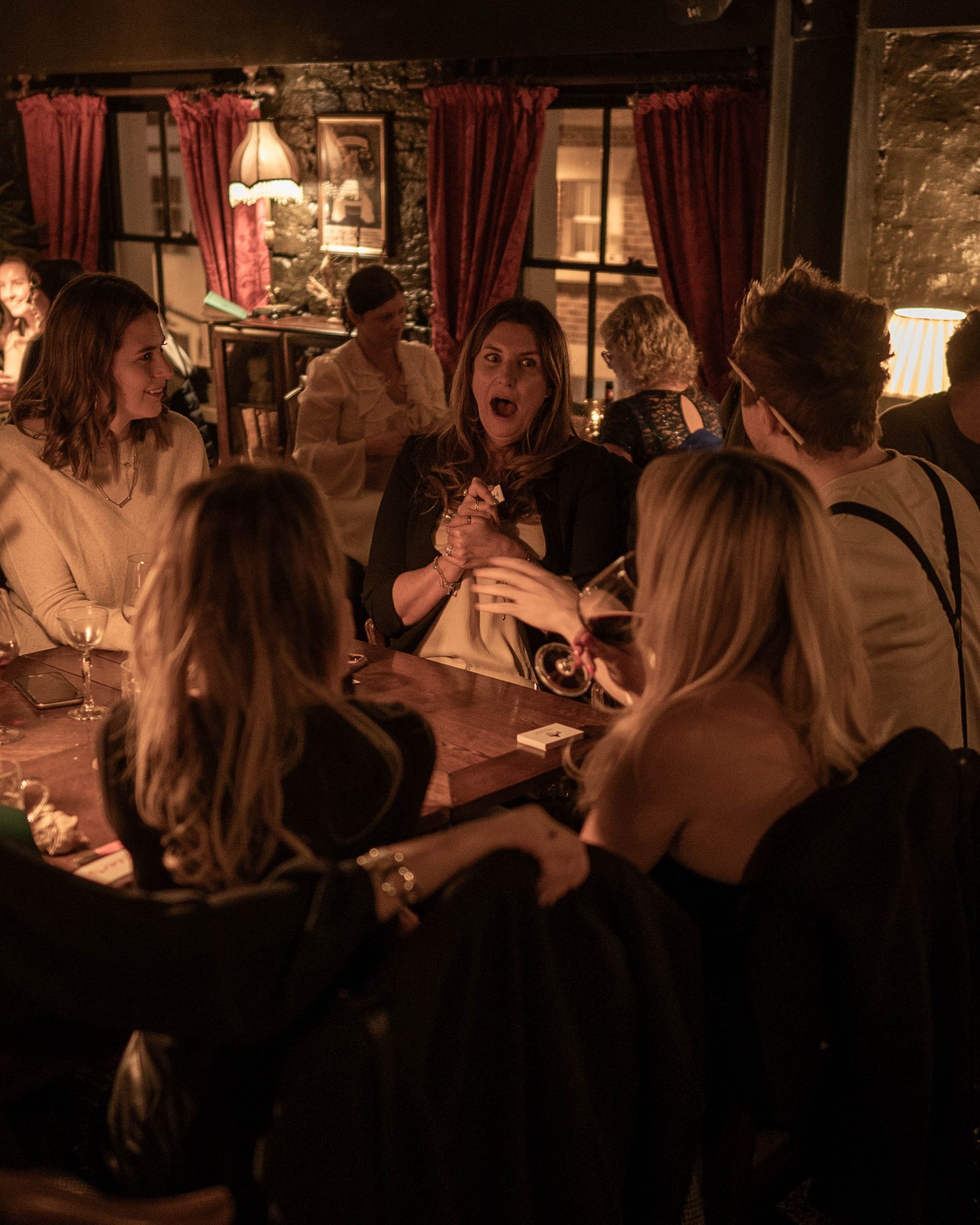 Benjamin performing for a dinner table